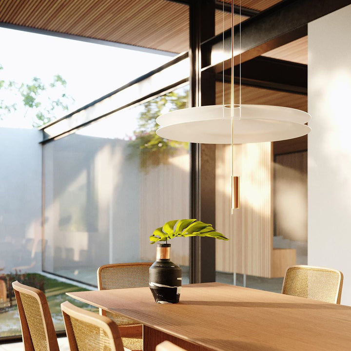 Elegant black floating disc pendant, modern LED, stylish home illumination.