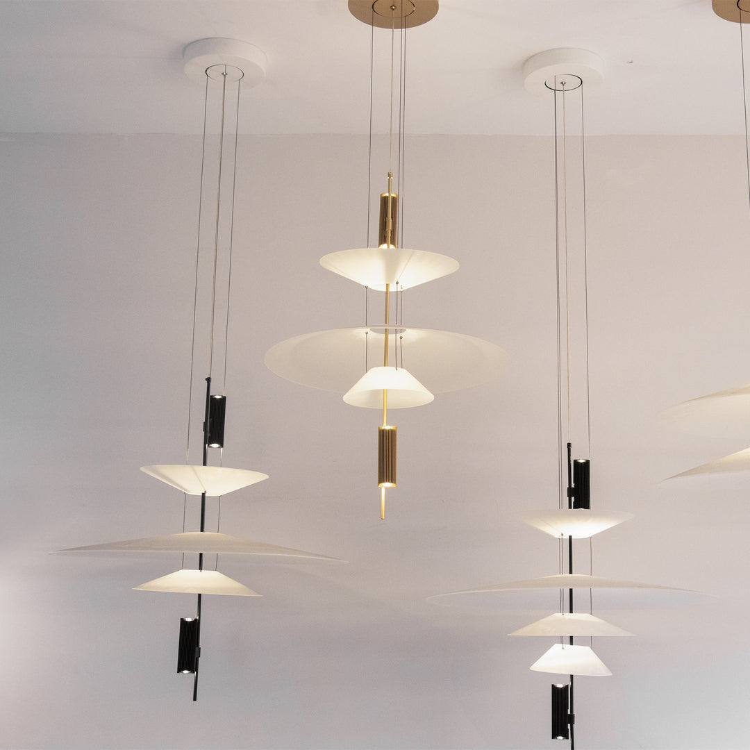 Contemporary disc ceiling fixture, integrated LED, black finish, ambient illumination.