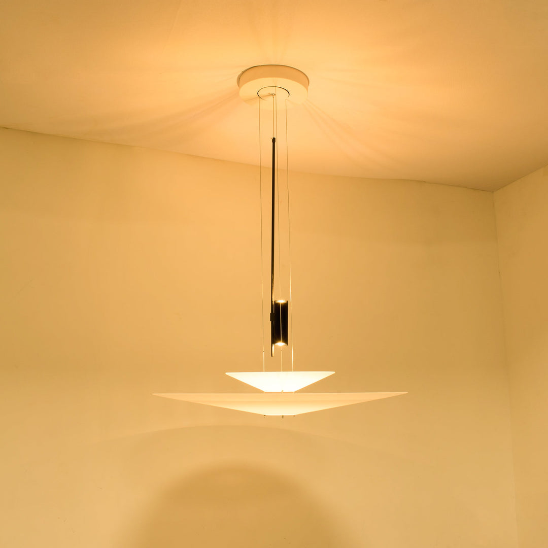 Sleek floating disc pendant, modern LED light, gold tone, stylish home decor.