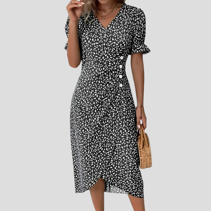 Women's V-neck floral midi dress, perfect for summer occasions.