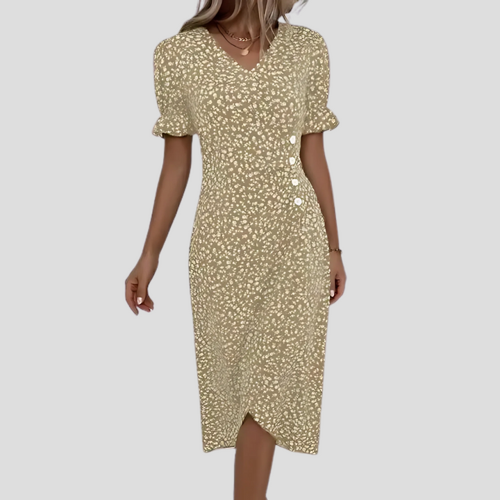 Flattering V-neck summer dress with short puff sleeves and a floral pattern.