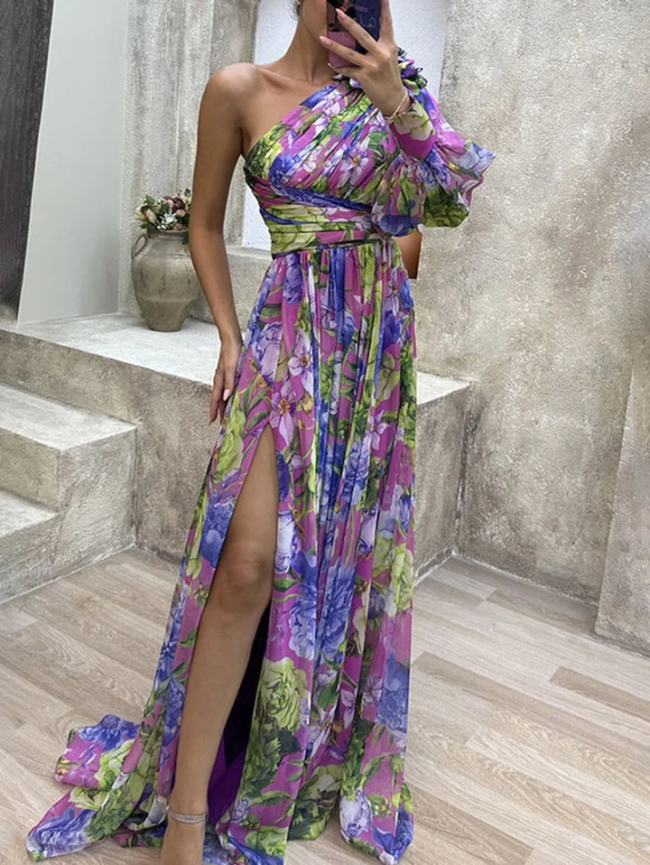 Vibrant floral one-shoulder maxi dress, perfect for women's summer style. Features high slit & design.