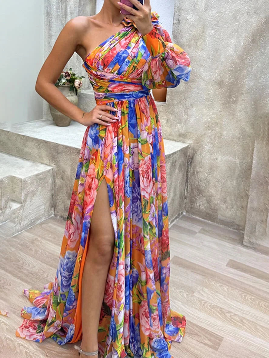 Beautiful floral one-shoulder women's maxi dress with an alluring high slit & fashionable puff sleeve detail.