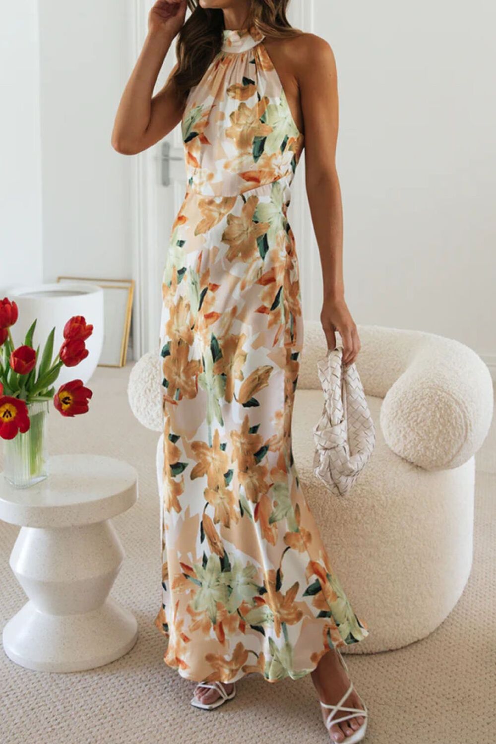 Versatile floral halter dress, perfect as a wedding guest or formal party attire.