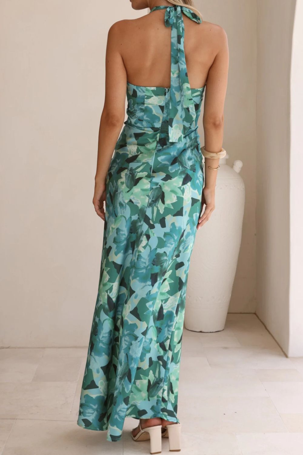 Exquisite floral halter dress, designed for elegance at weddings and formal gatherings.