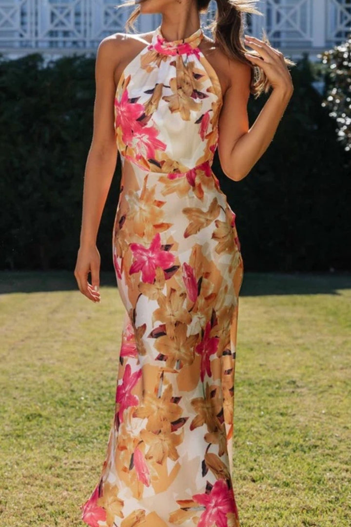 Chic floral halter dress featuring a dramatic leg slit, ideal as a formal evening gown.