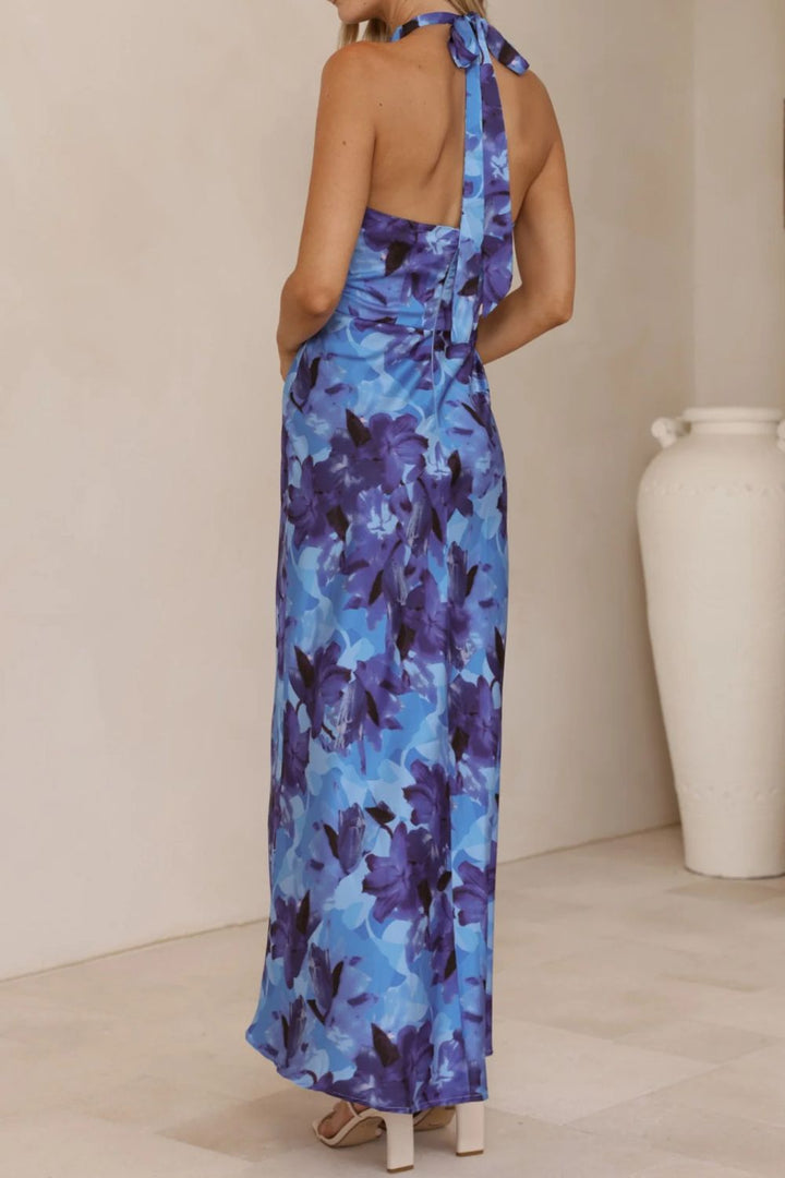Glamorous floral evening gown with a halter top and a sophisticated, floor-sweeping slit.