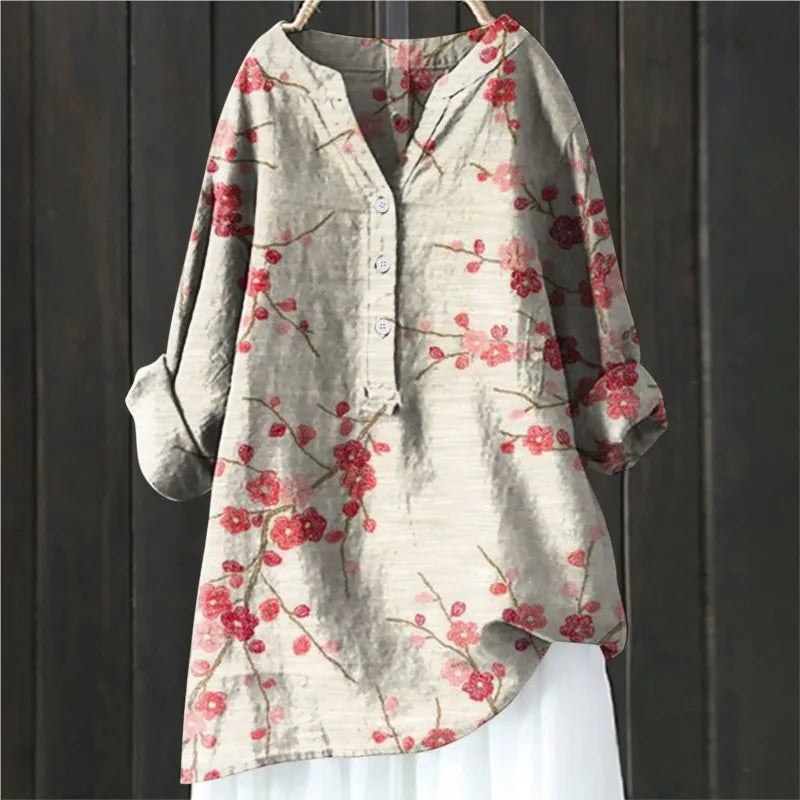 Elegant floral print V-neck long-sleeve women's blouse. Perfect for casual spring/summer style.