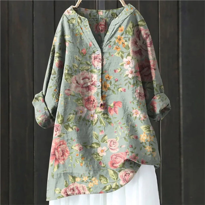 Stylish floral print long-sleeve women's blouse. Elegant casual top for spring and summer fashion.