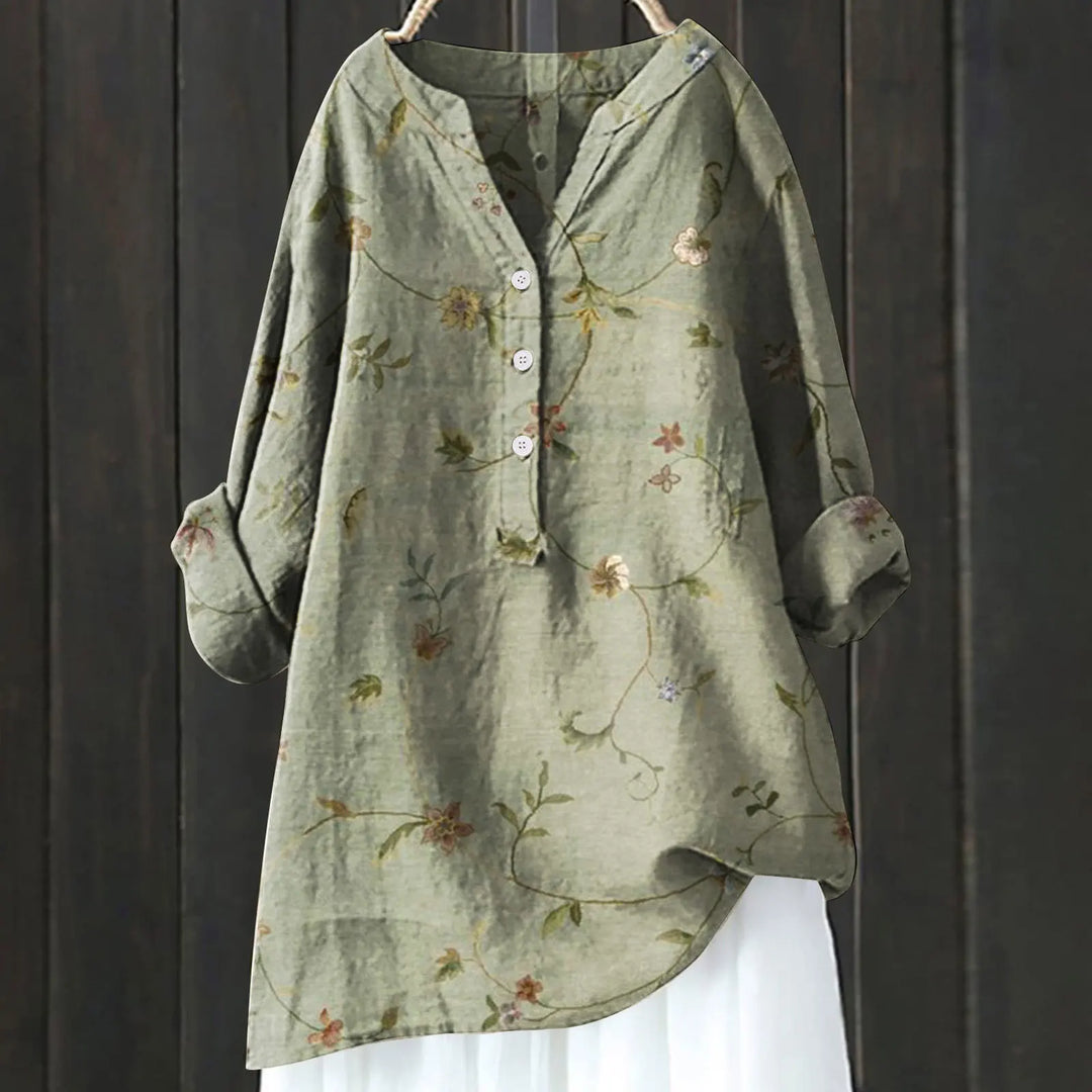 Vibrant floral print women's blouse, a comfortable V-neck long-sleeve casual top for elegant spring fashion.
