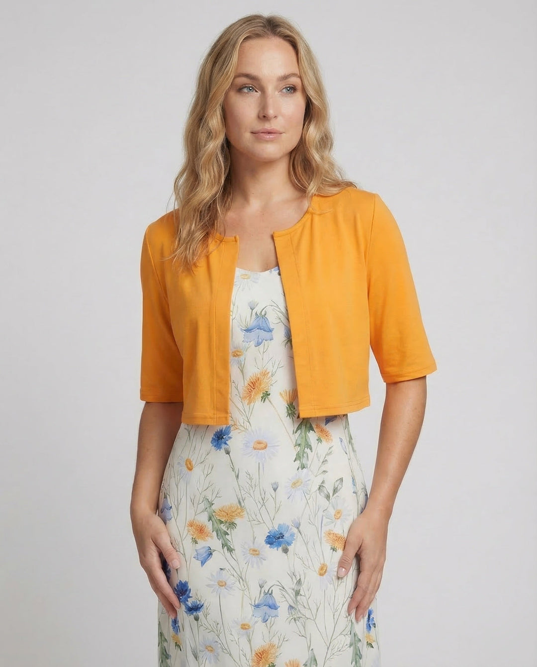 Women's summer fashion: stylish floral crop top and matching skirt set.