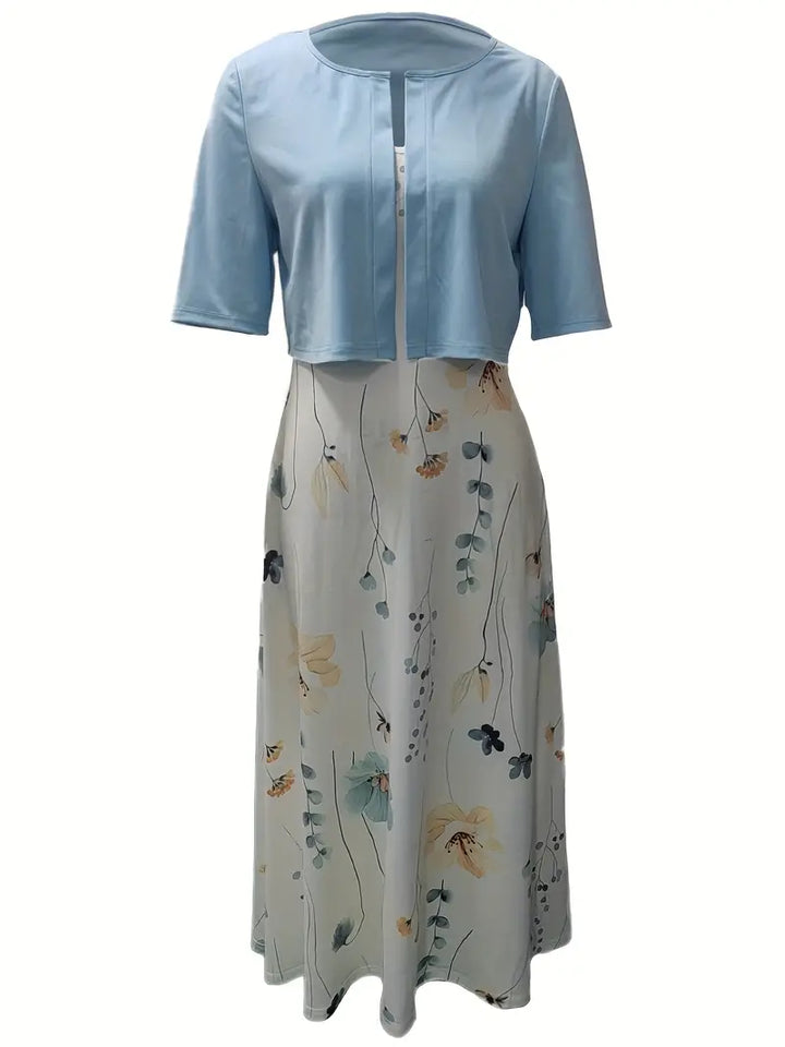 Stylish women's floral dress set featuring a fashionable crop top and skirt.