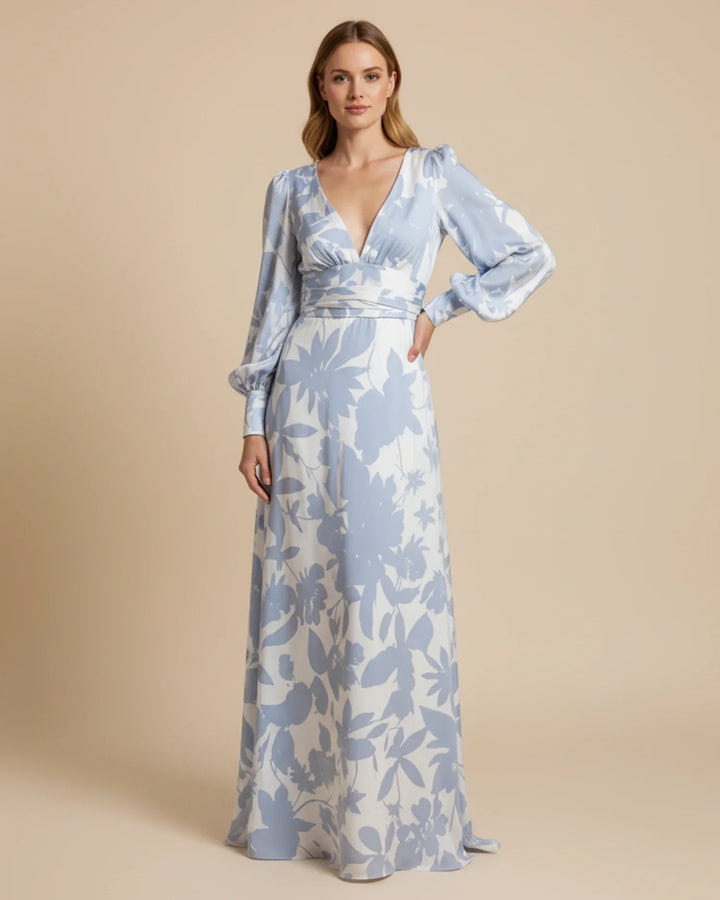 Elegant floral V-neck maxi dress with bishop sleeves, perfect for a wedding guest or summer occasion.