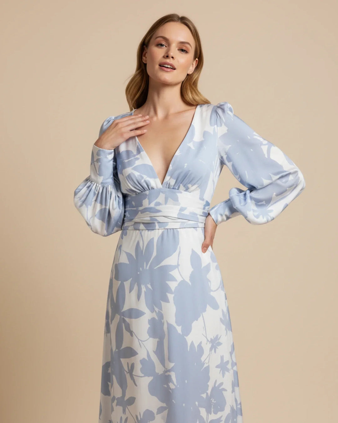 Women's elegant floral maxi dress featuring a flattering V-neck and stylish bishop sleeves.
