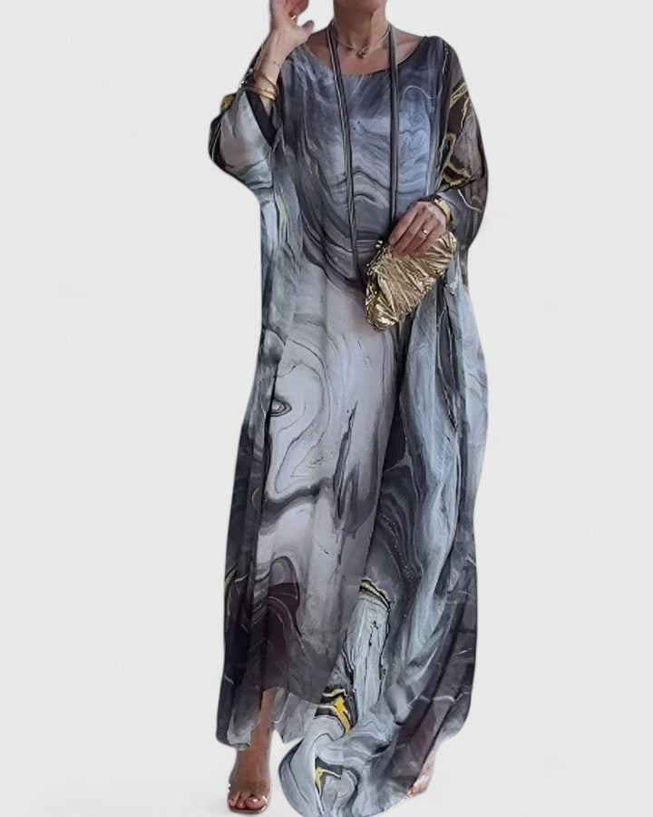 Beautiful women's flowy maxi dress in a soft, elegant fabric, ideal for summer evenings or formal events.