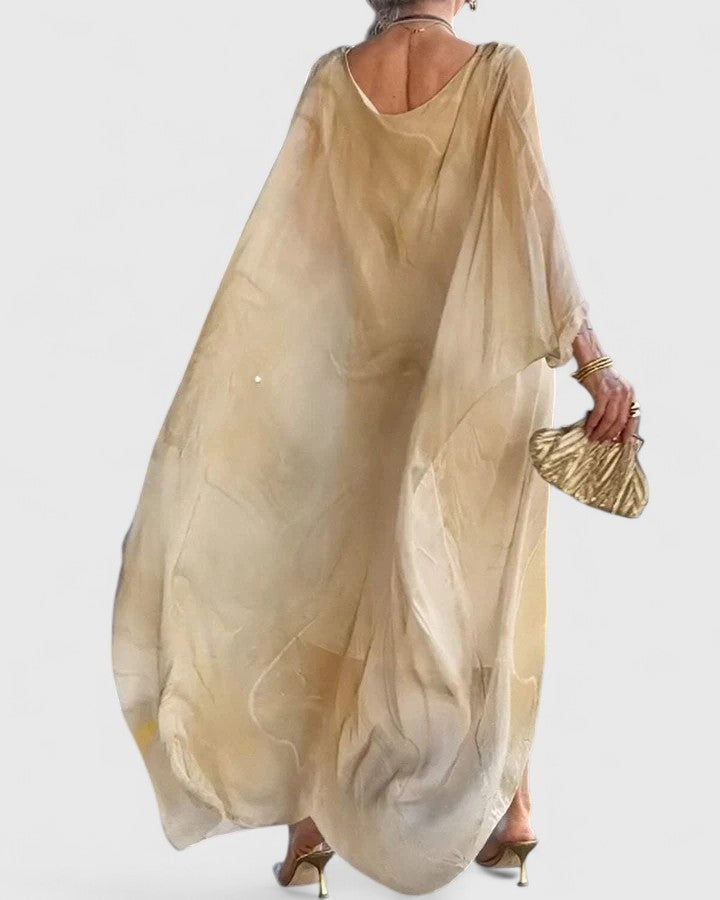 Elegant women's maxi dress with a flattering silhouette and flowy skirt, suitable for any special occasion.