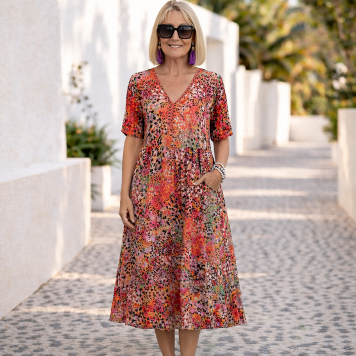 Elegant flowy midi dress for women, comfortable & stylish. Perfect for summer casual wear or special occasions.