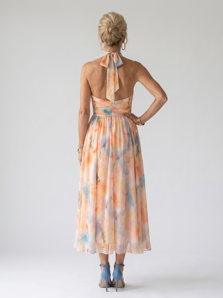 Chic multi-color flowy halter midi dress, ideal for women's summer style and comfortable casual wear.