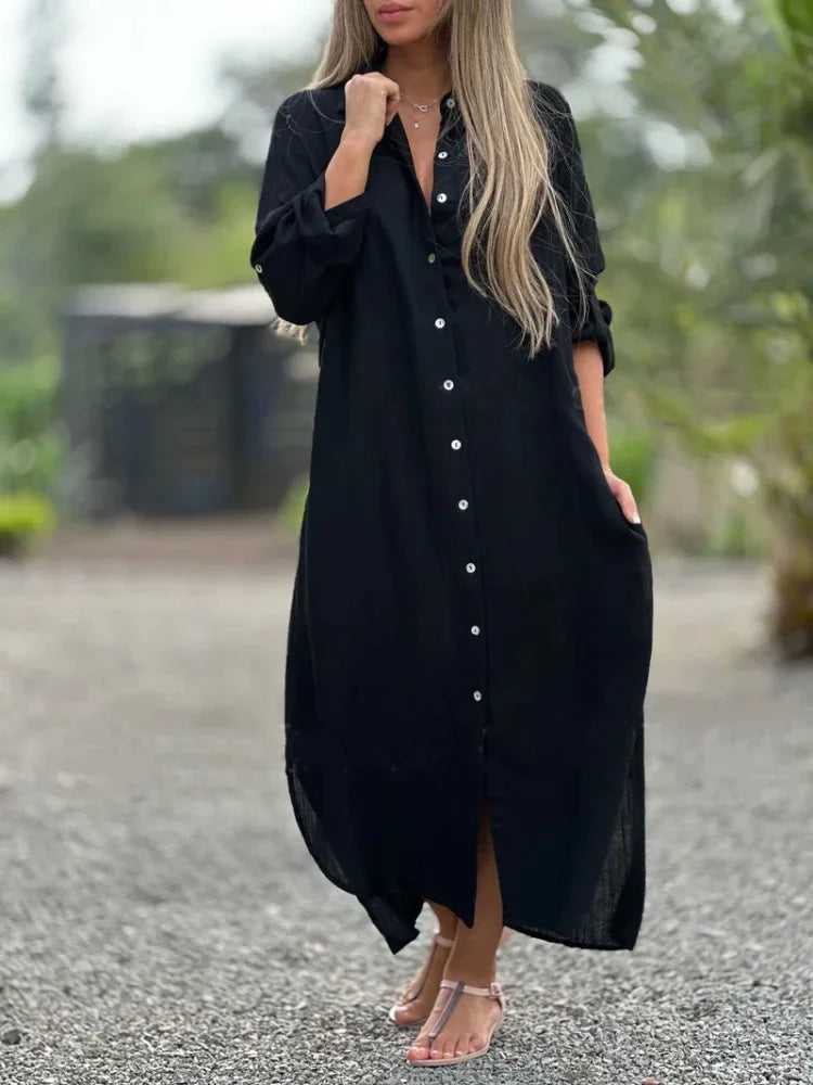 Black elegant flowy maxi dress for women. Versatile summer dress, suitable for beach, casual, or evening wear.