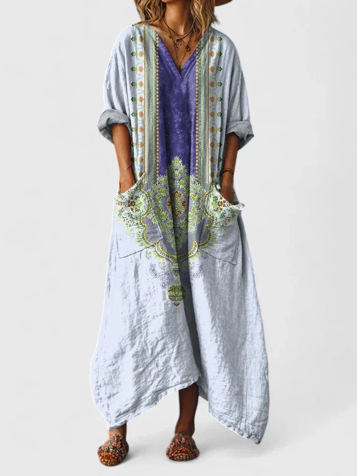 Casual yet elegant women's long dress, perfect for summer, featuring a beautiful print, flowy cut, and pockets.