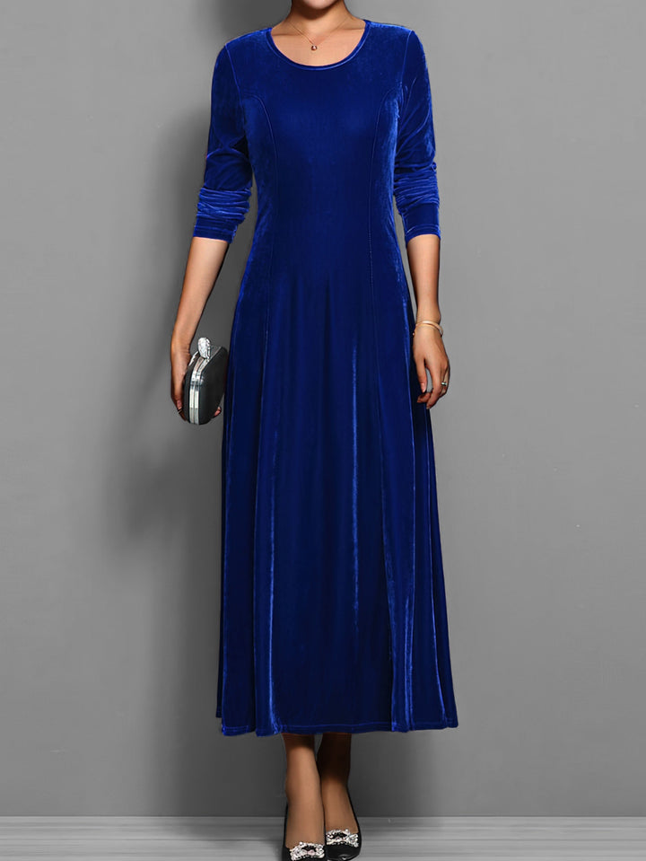 Elegant full-length women's flared maxi dress with long sleeves, round neck. Versatile evening/day wear.
