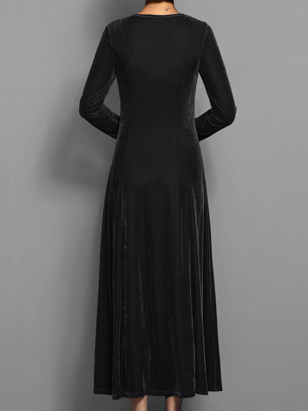 Chic women's full-length flared maxi dress, long sleeves, round neck. Elegant day or evening fashion.