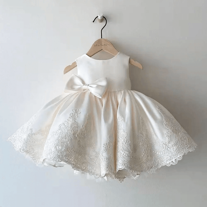 Elegant Girls Aurora Princess Dress with intricate lace detailing and a beautiful satin bow, perfect for parties and special occasions.