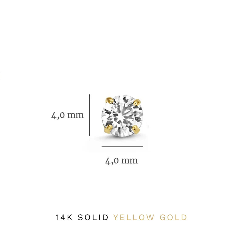Close-up of women's fashion gold earrings featuring brilliant white stones.