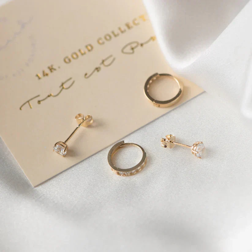 Luxurious rose gold statement earrings adorned with dazzling gemstones.