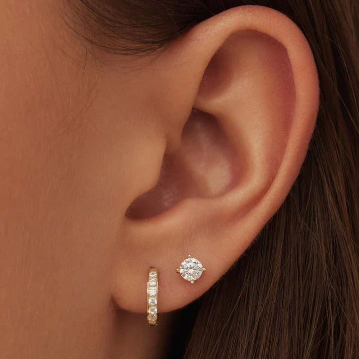 Beautiful gold drop earrings with intricate stone detailing for special occasions.