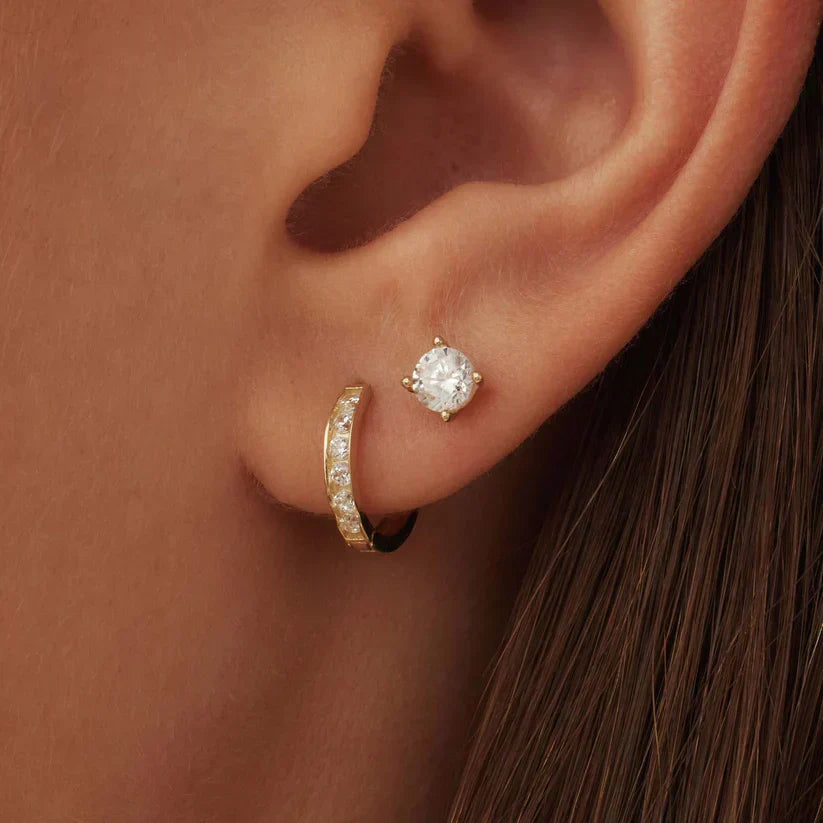 Gift idea: Elegant gold earrings with sparkling stones for women.