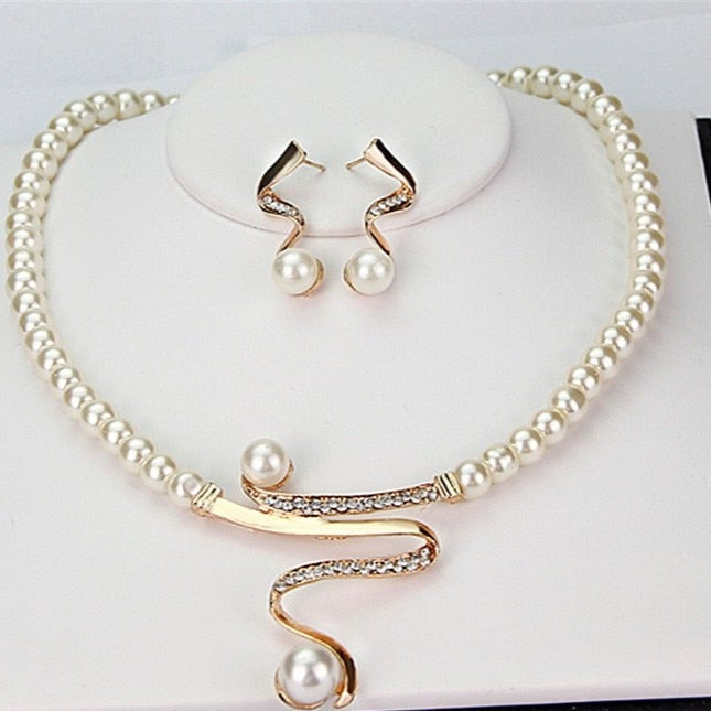 Elegant gold necklace and earring jewelry set for women. Perfect classic style accessory for special occasions or a gift.