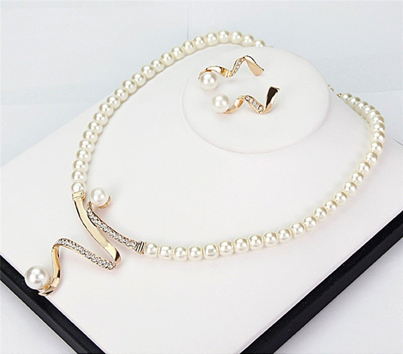 Beautiful women's gold jewelry set with elegant necklace & earrings. Ideal accessory for parties, weddings, or a special gift.