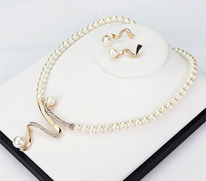 Beautiful women's gold jewelry set with elegant necklace & earrings. Ideal accessory for parties, weddings, or a special gift.