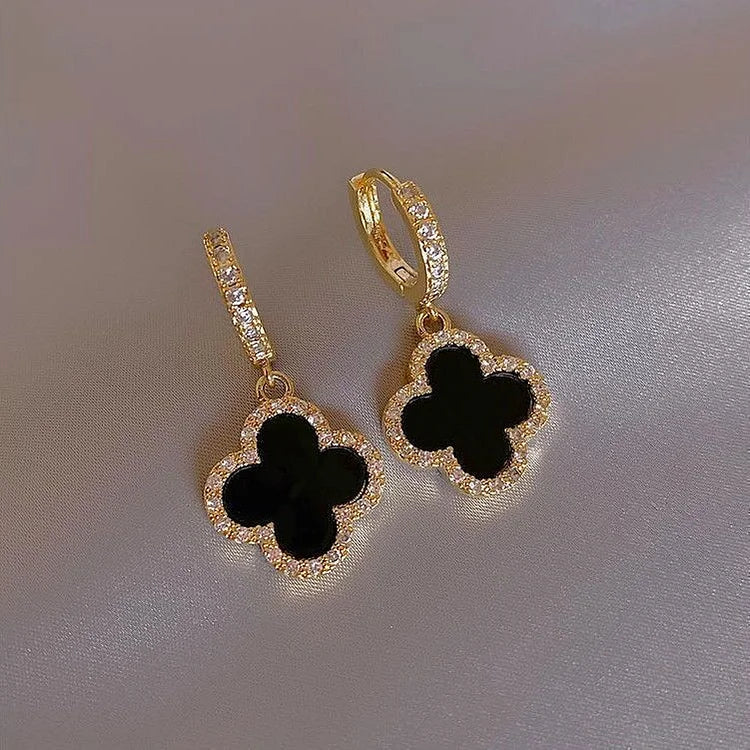 Sparkling crystal clover leaf earrings, gold plated. Elegant women's jewelry, a lucky charm for everyday wear.