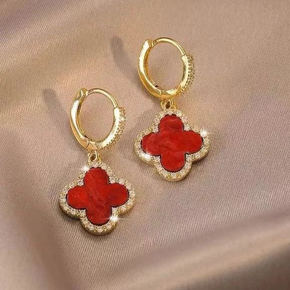 Versatile gold-plated clover leaf earrings with crystals. Elegant women's lucky charm for everyday fashion.