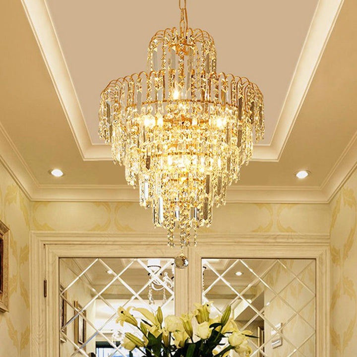 Classic tiered crystal chandelier with a sparkling gold finish, creating dazzling light for upscale homes.