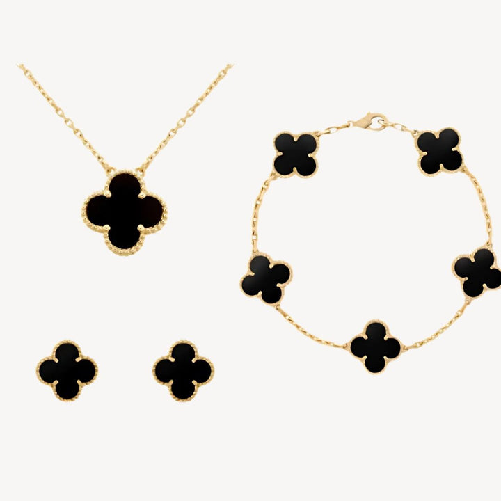 Gold-tone clover necklace, an elegant lucky charm for women. Perfect fashion accessory, available in multiple colors.