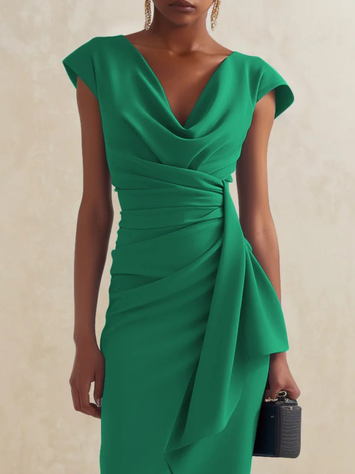 Sophisticated green cocktail party dress featuring a chic cowl neckline and ruched silhouette.