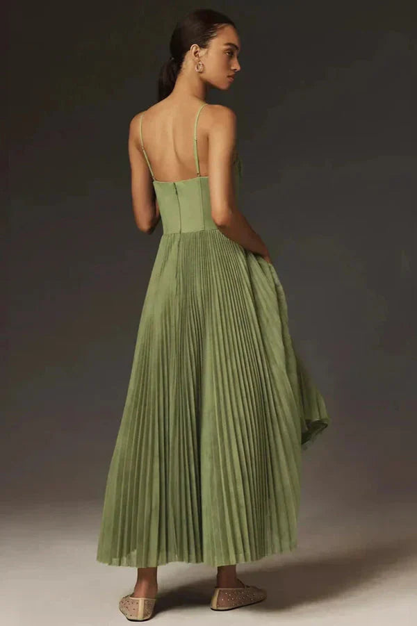Stylish women's summer midi dress, green, with a trendy bustier top, flowy A-line skirt, and beautiful pleats.