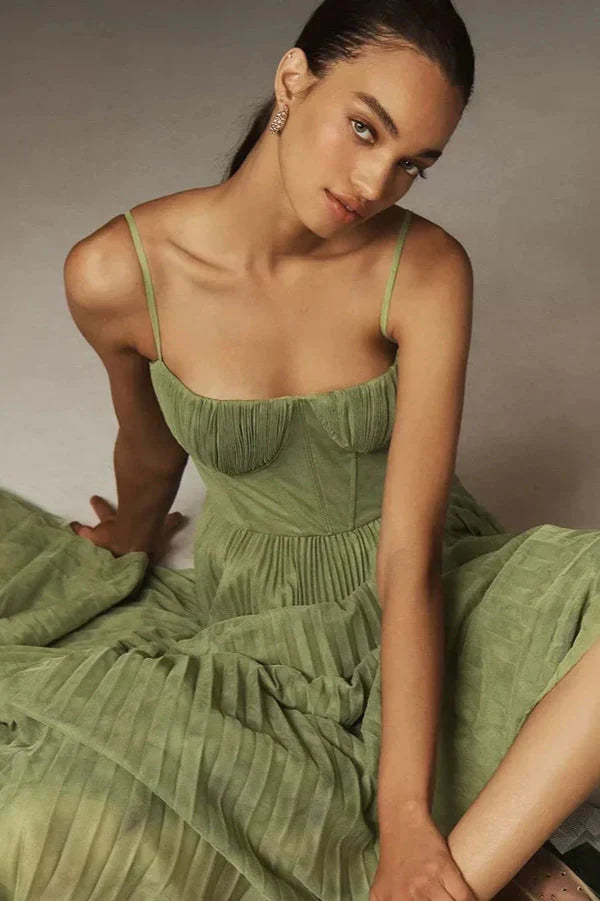 Green elegant A-line midi dress for women, perfect for evening wear, with a flattering pleated skirt and bustier design.