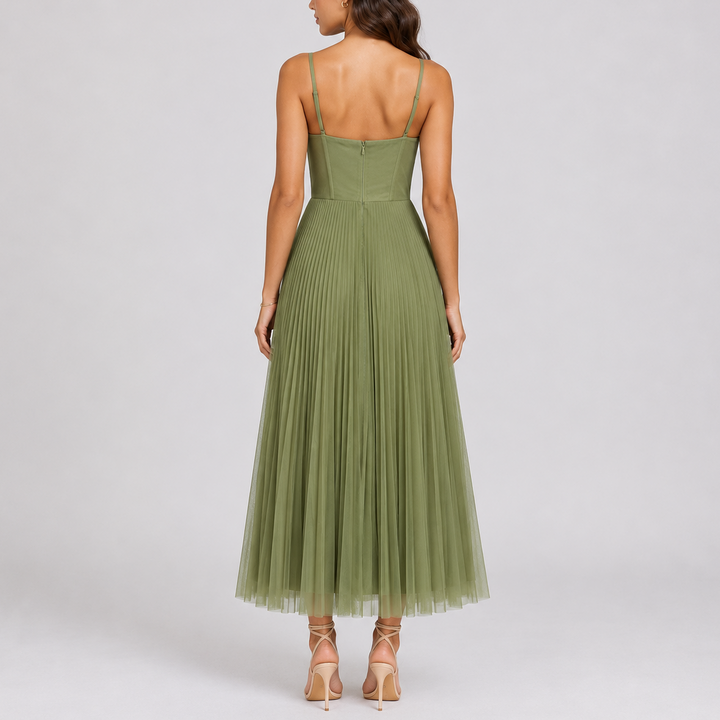 Women's graceful green pleated maxi dress, a long formal gown with elegant pleats, ideal for special occasions.