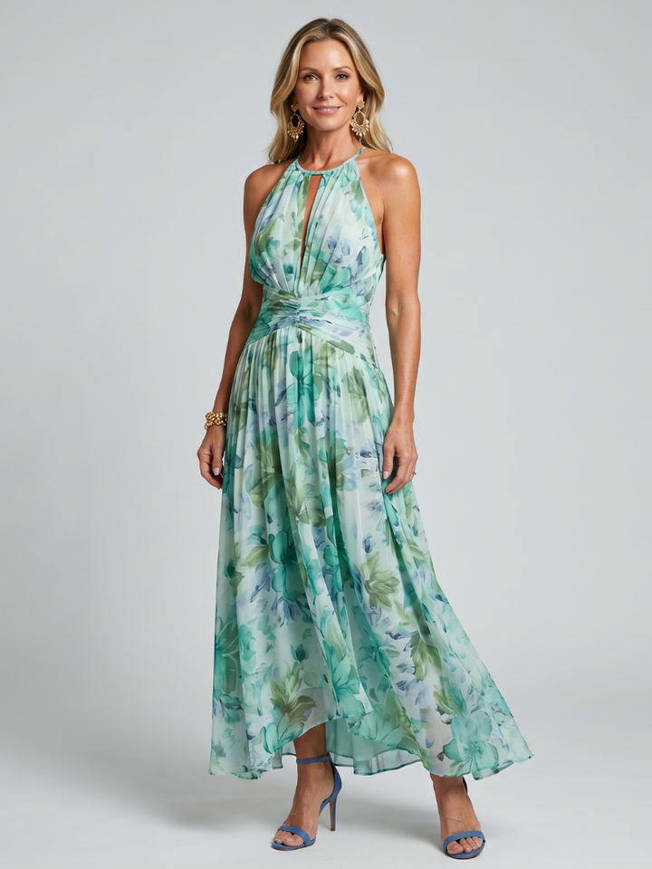 Elegant green women's pleated halter midi dress with vibrant floral pattern. Perfect summer occasion wear.