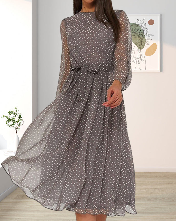 Everyday elegance: Women's knee-length polka dot dress with a relaxed A-line cut.