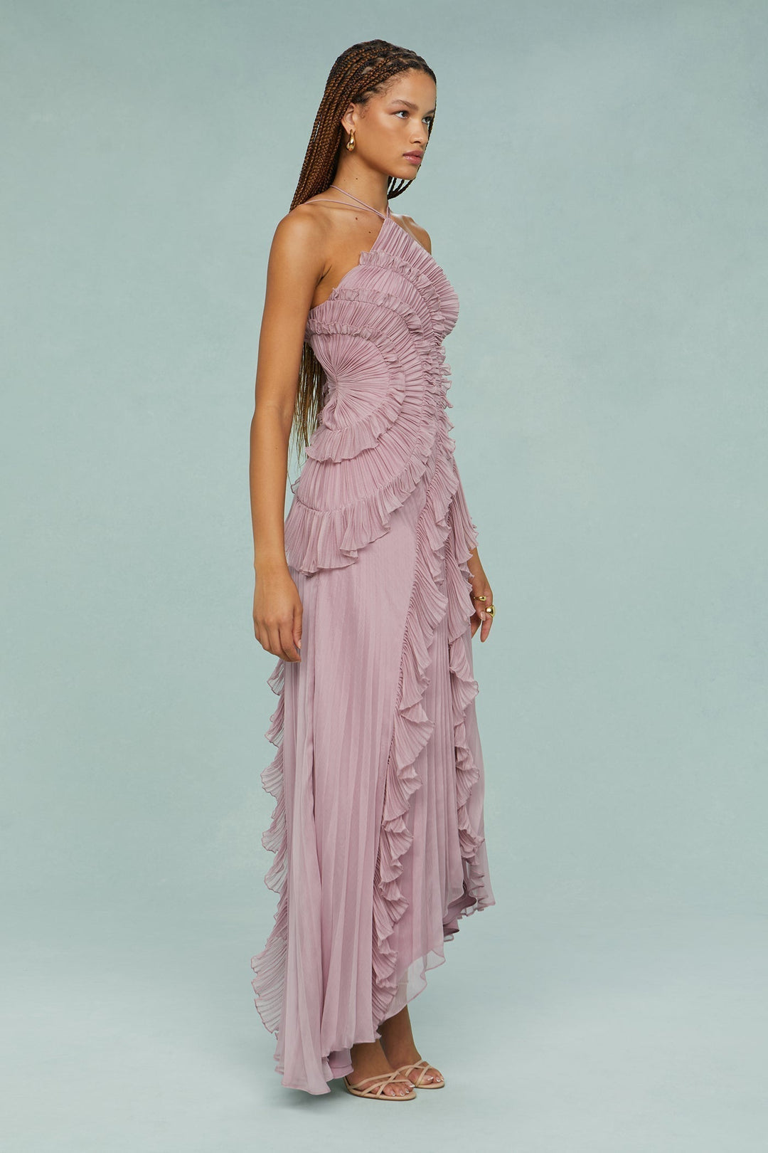 Flowing lila pleated maxi dress featuring a stylish halterneck, perfect for any special occasion.