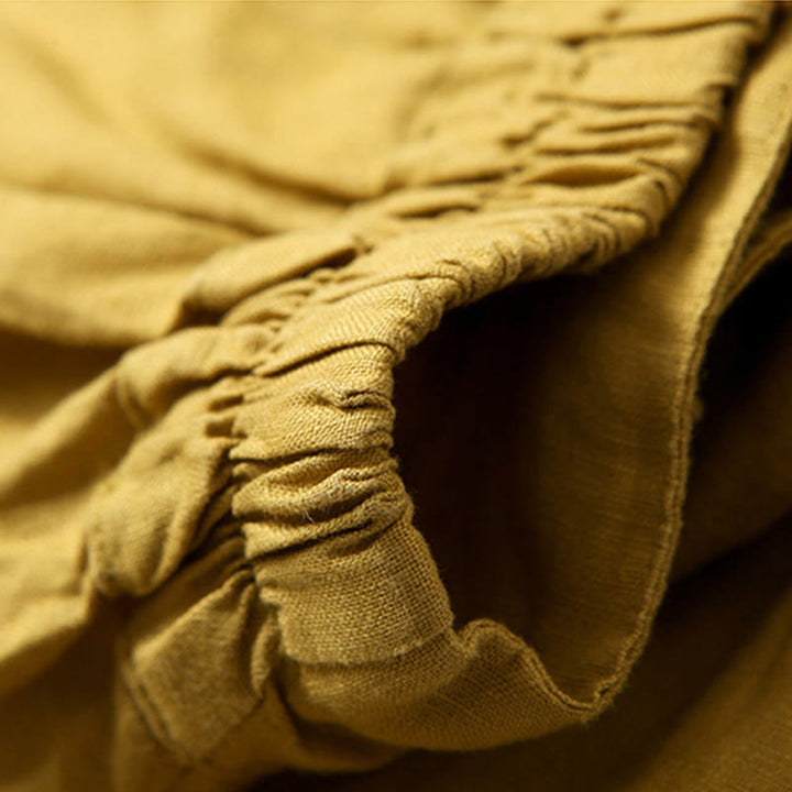 Stylish pleated high-waist wide-leg trousers for women, versatile for casual or office fashion.