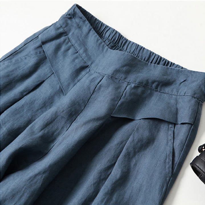 Versatile women's high-waist wide-leg trousers, combining comfort with modern office style.
