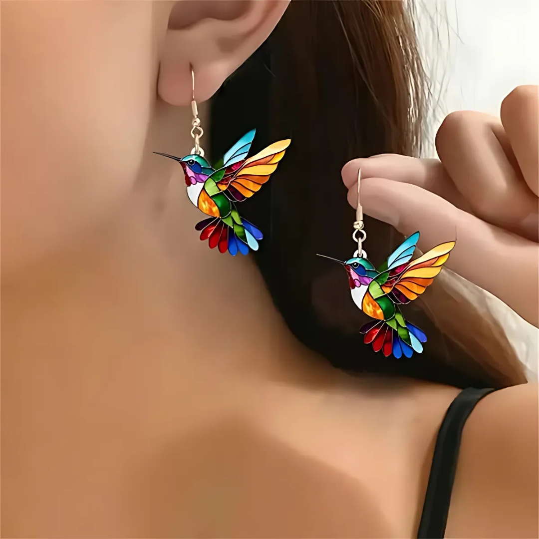 Gold hummingbird necklace with matching earrings, perfect party accessory.