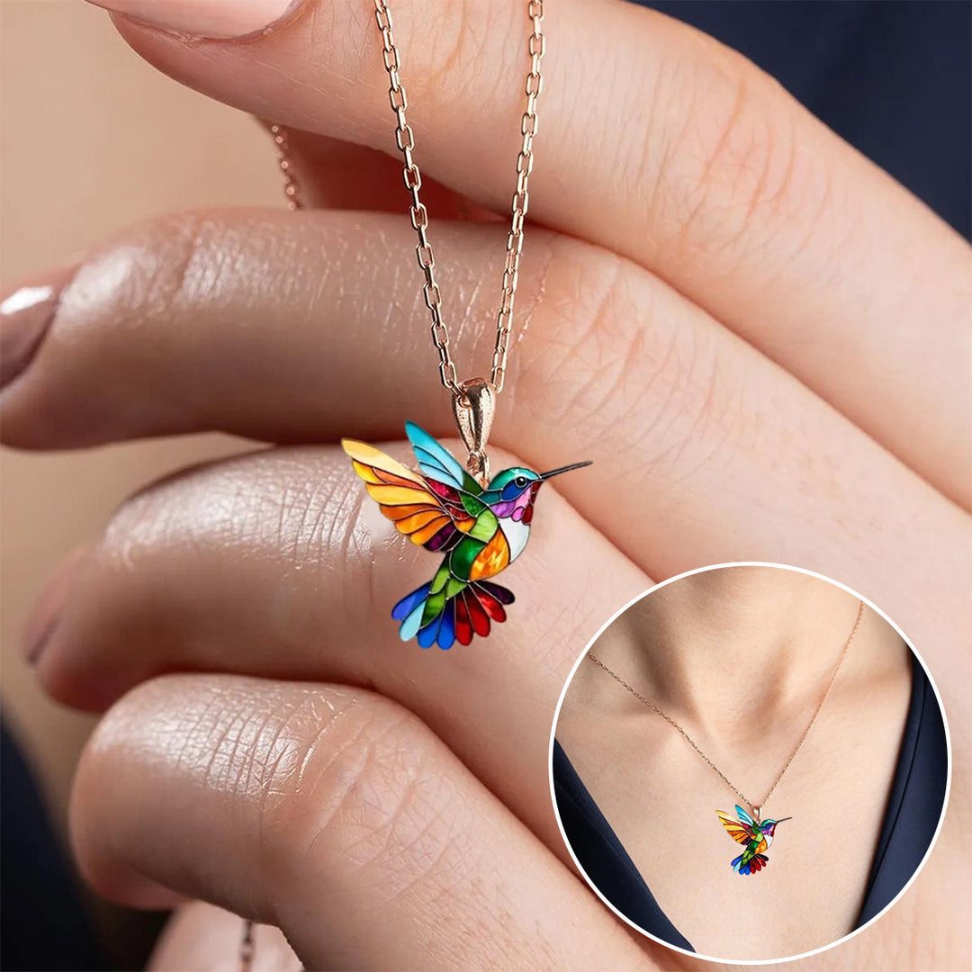 Modern elegant hummingbird necklace with delicate matching earrings.