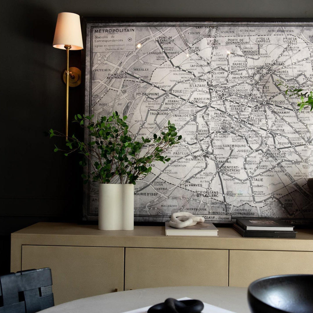 Ambient indoor wall lamp with soft fabric shade, perfect for creating a cozy bedroom.